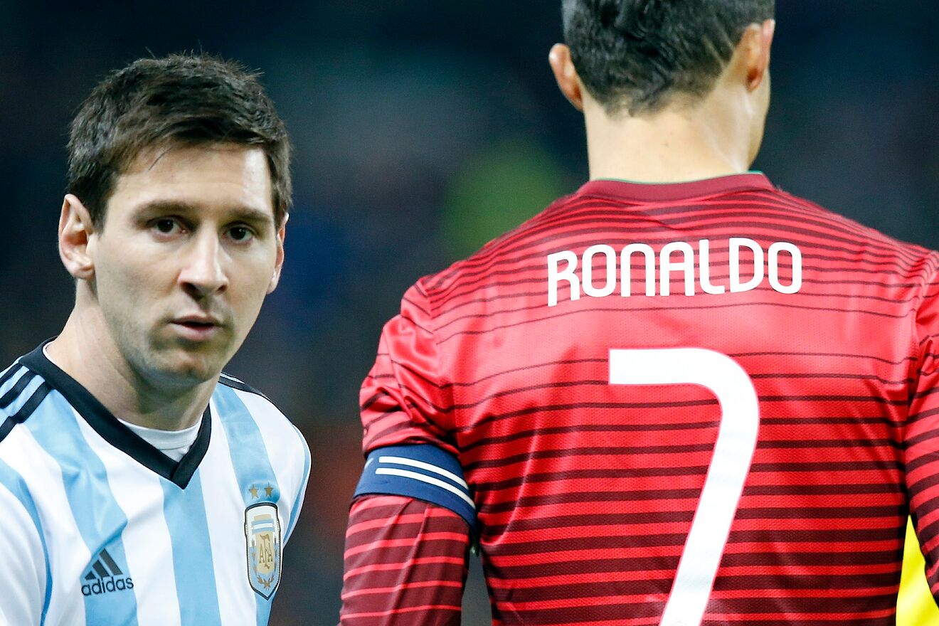 Lionel Messi of Argentina, left, stands next to Cristiano Ronaldo of...