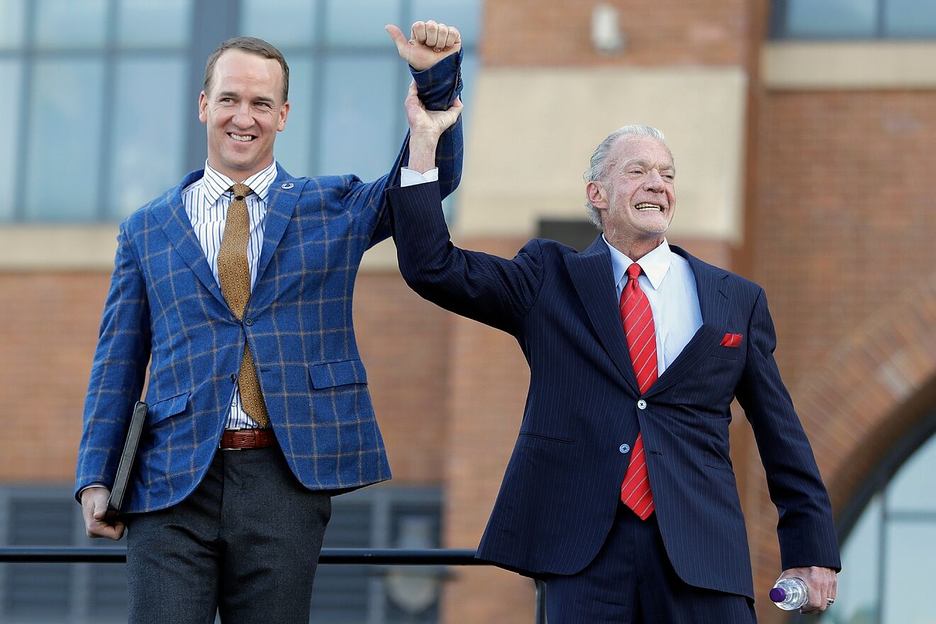 Peyton Manning and Indianapolis Colts owner Jim Irsay acknowledge fans...