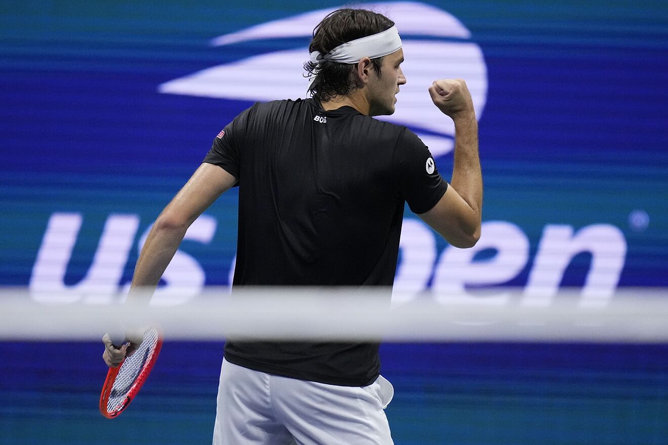 Taylor Fritz, of the United States, reacts against Frances Tiafoe, of...