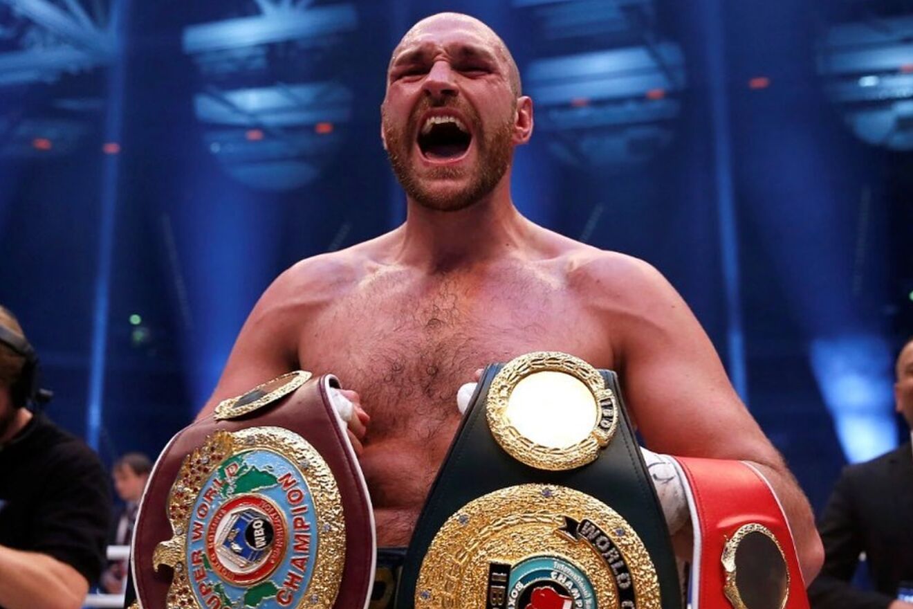Tyson Fury celebrates his first undisputed Heavyweight title after...