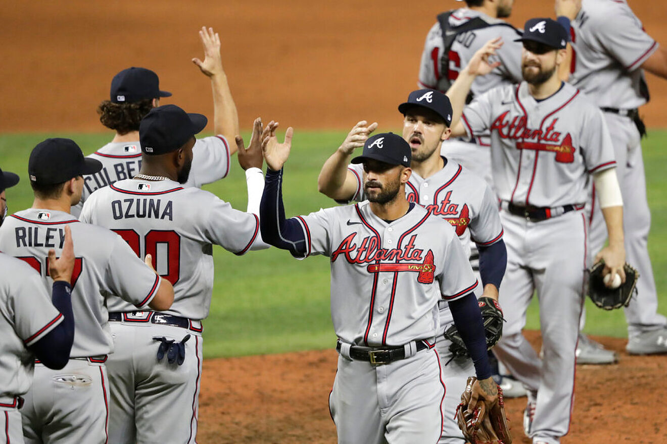 The Atlanta Braves shake hands during the 2020 MLB regular season.