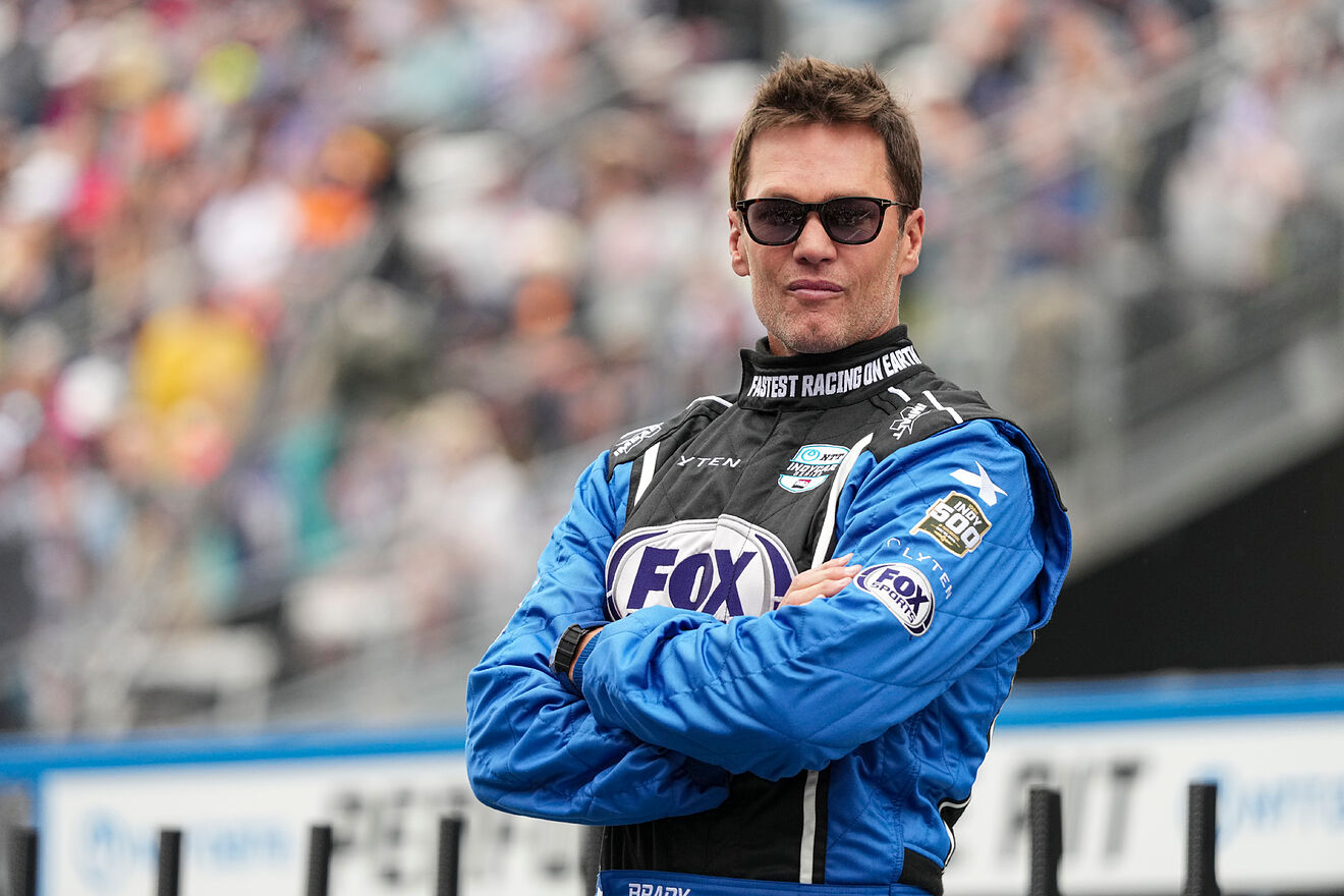 Former NFL quarterback Tom Brady waits in the pit area before the...