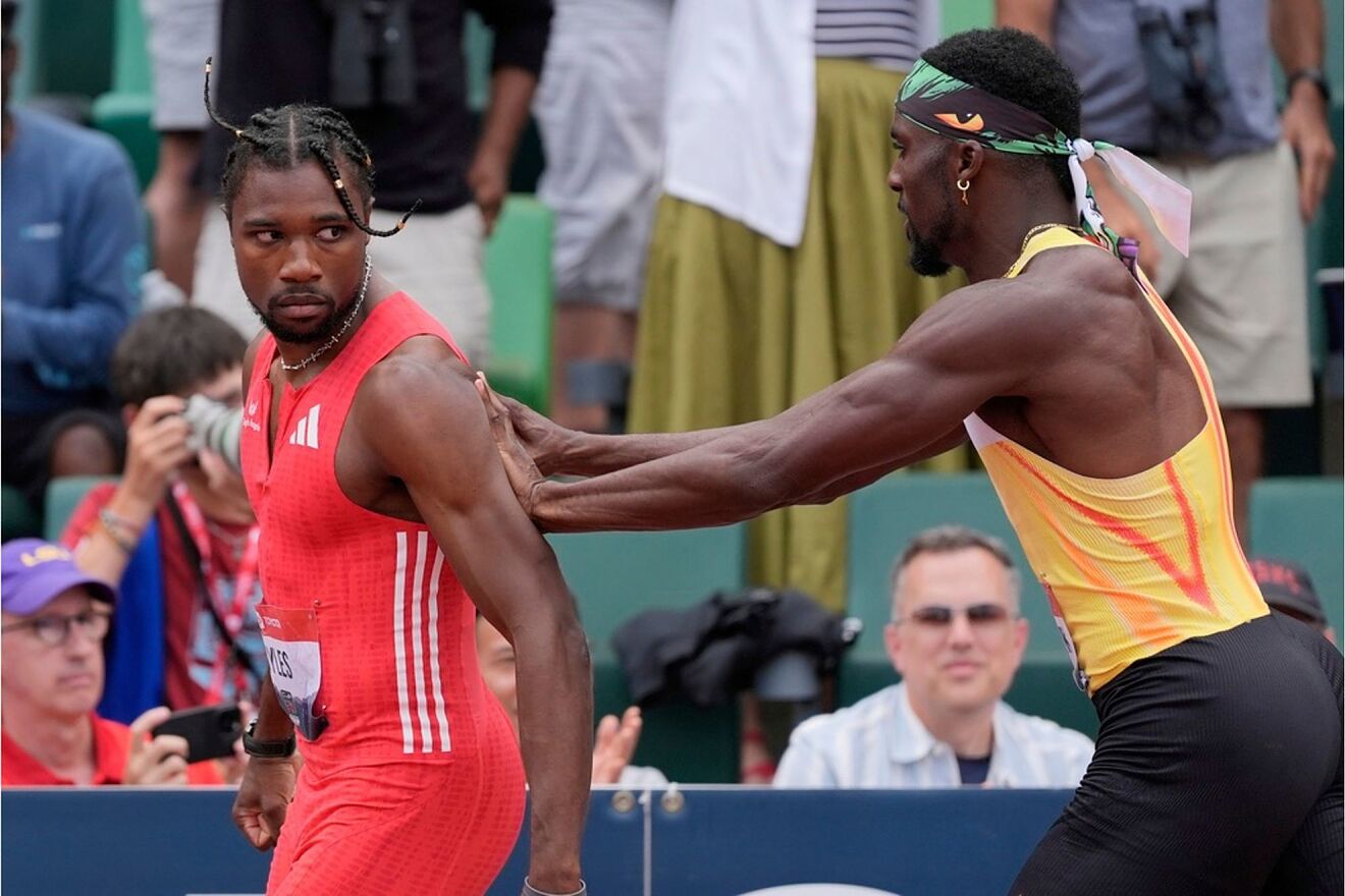 Kenny Bednarek pushes Noah Lyles after the men's 200-meter finals...