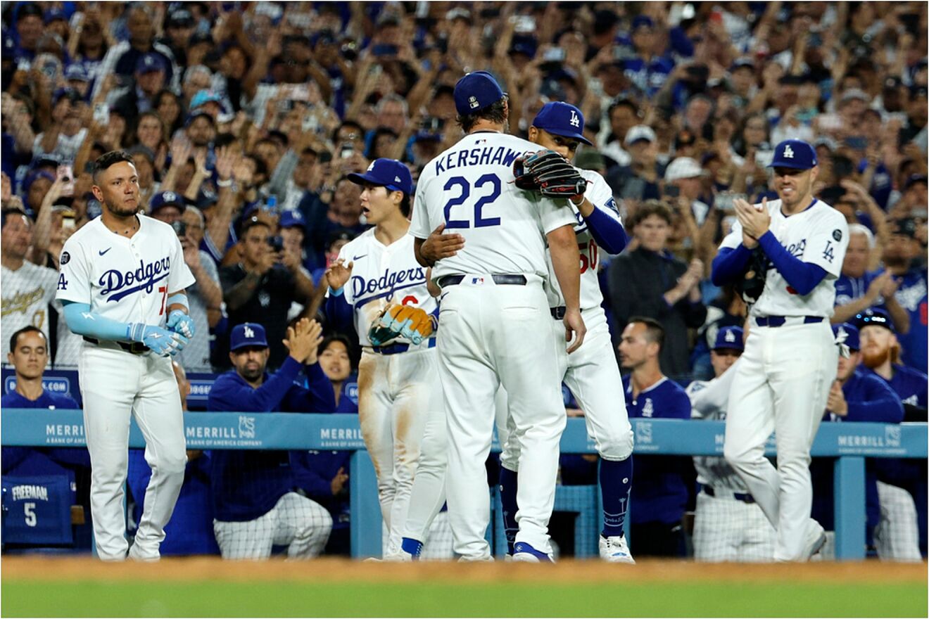Los Angeles Dodgers pitcher Kershaw (22) gets hug from Betts after...
