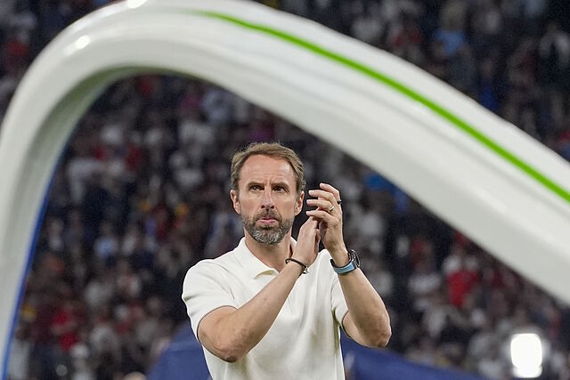 England's manager Gareth Southgate applauds to supporters at the end of the final match between Spain and England.