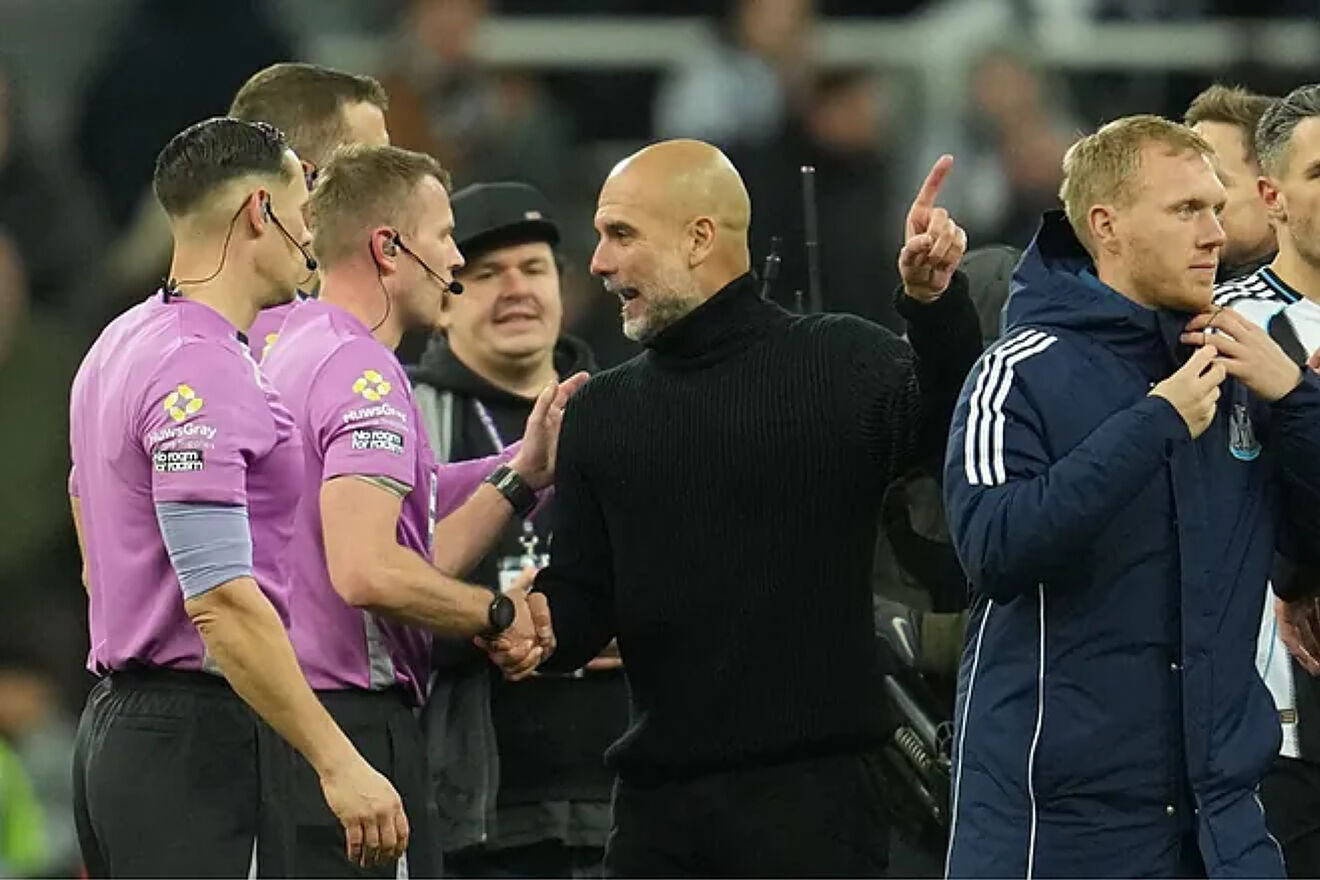 Pep Guardiola faces the referee after the match against Newcastle.