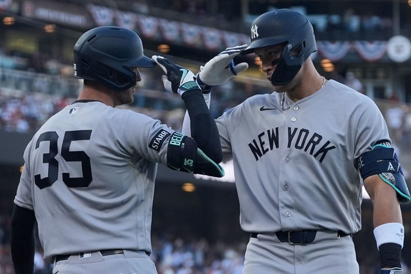 New York Yankees' Aaron Judge, right, is congratulated by Cody...