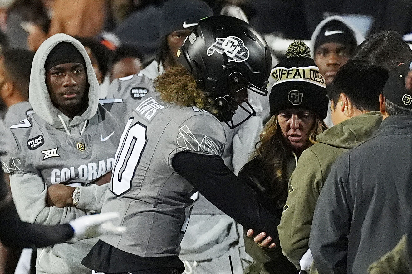 Julian Lewis is checked after injuring his arm late in the second half