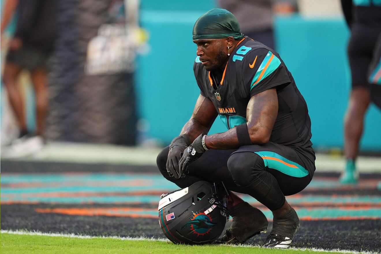 Miami Dolphins wide receiver Tyreek Hill sits in the end zone before...