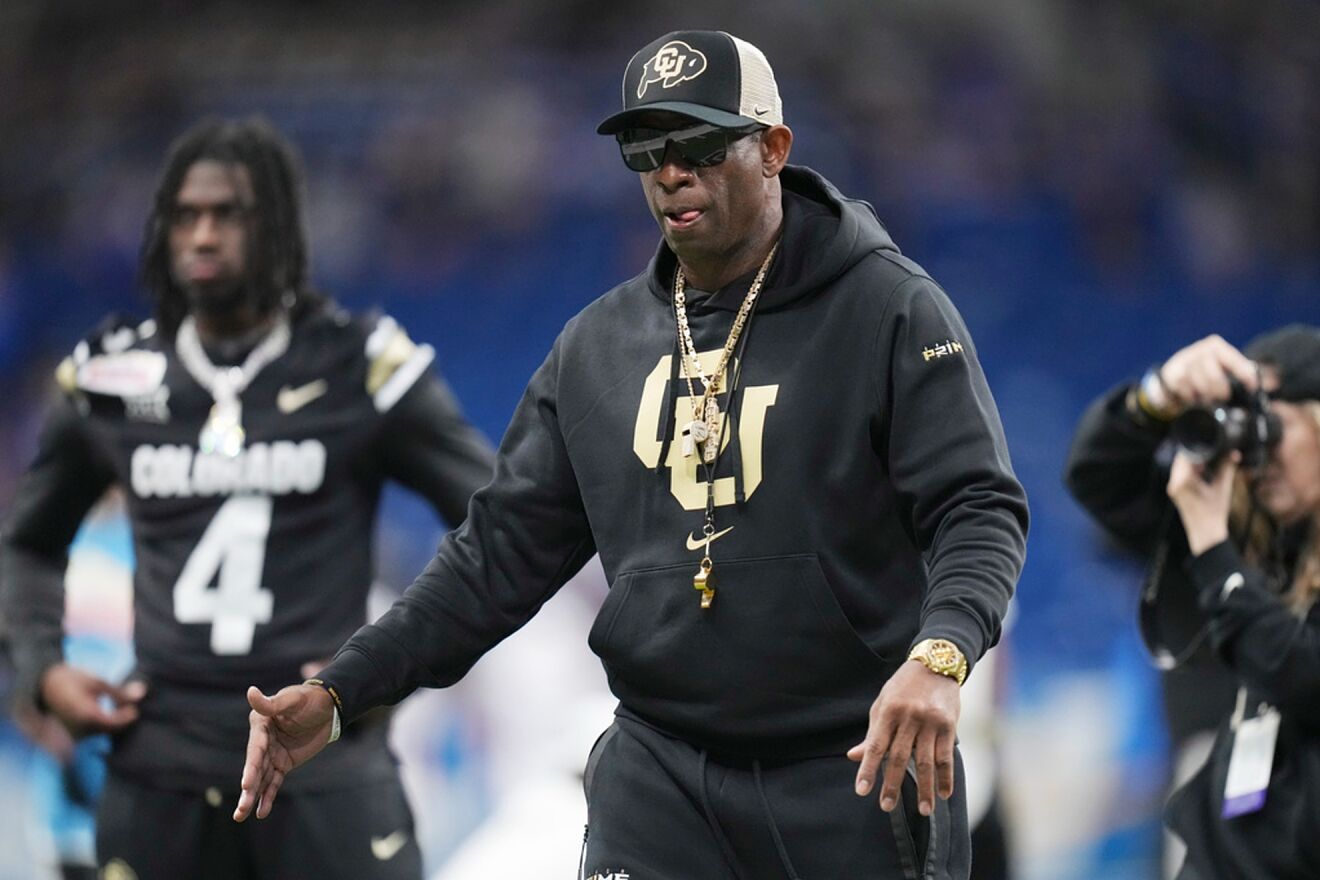 Buffaloes' Deion Sanders walks out to the field before the Alamo Bowl...