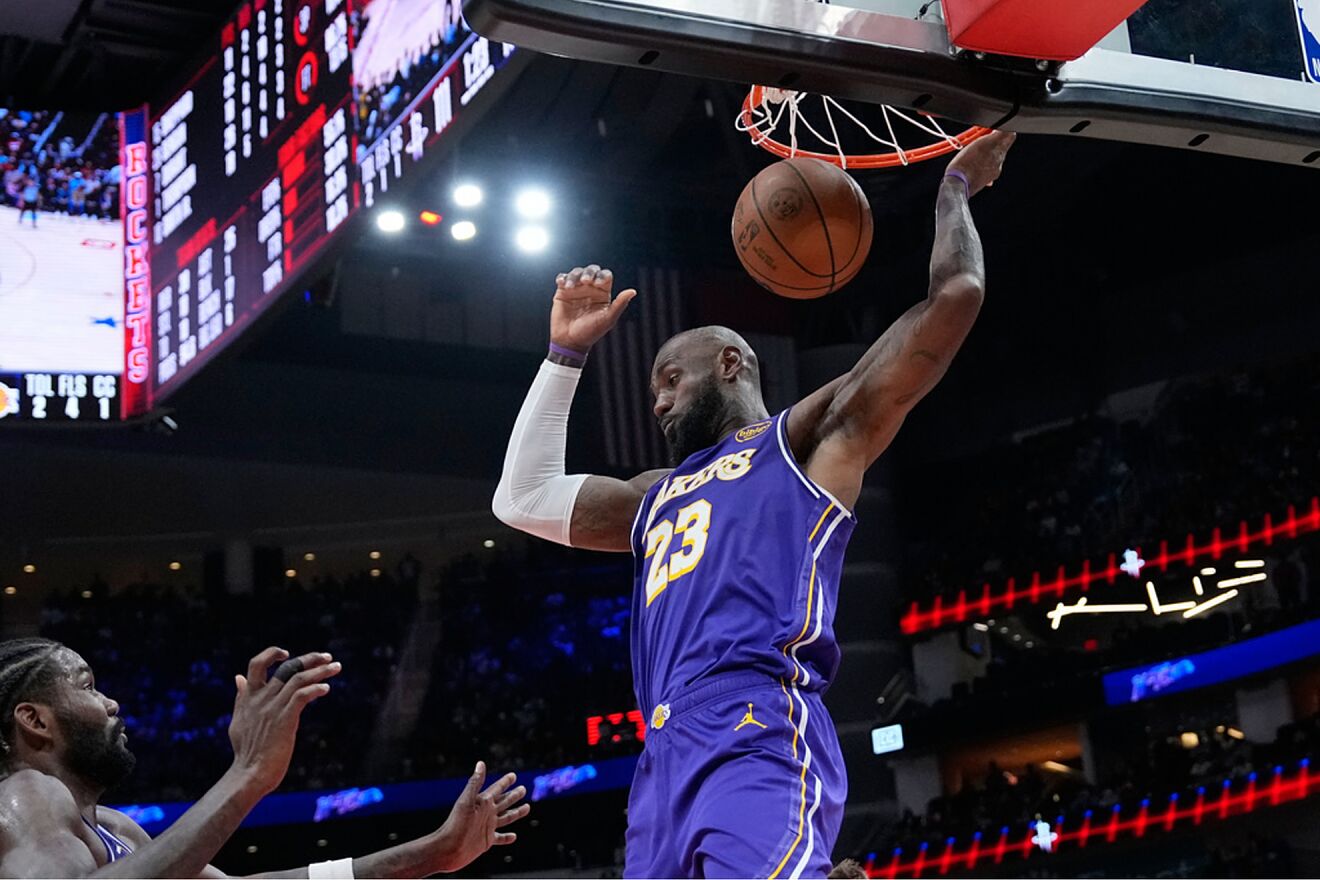 Los Angeles Lakers' LeBron James dunks the ball against the Houston...