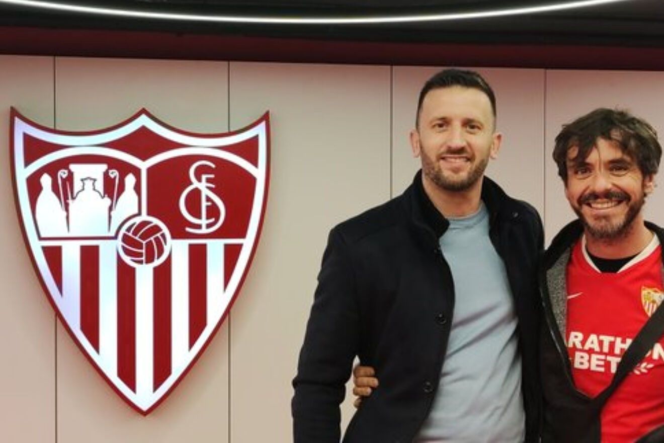Two Sevilla fans witness a match within the Sanchez Pizjuan fortress