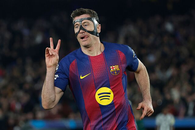 Barcelona's Robert Lewandowski celebrates after scoring his side's sixth goal during the Champions League round of 16