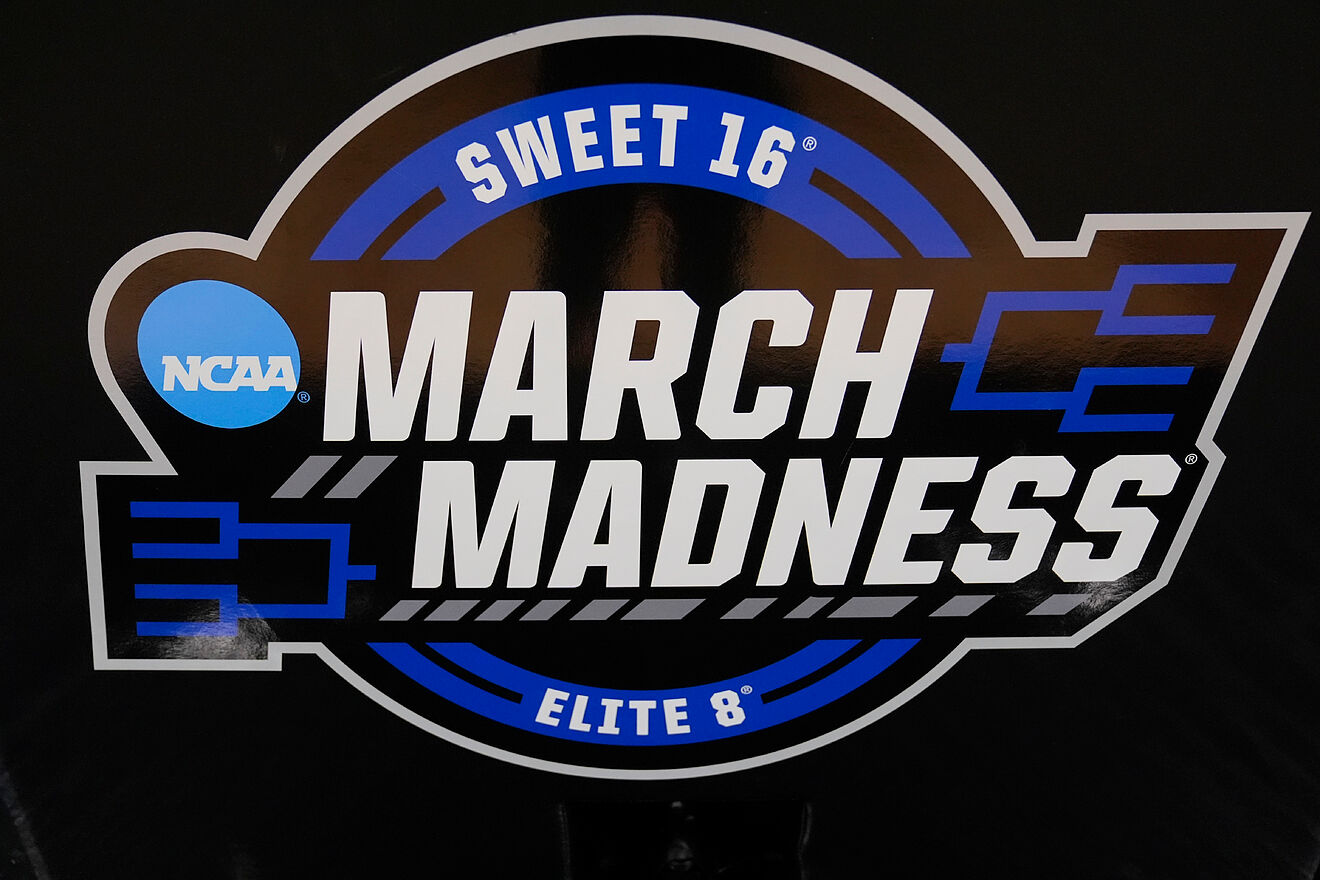 A Sweet 16 and Elite Eight NCAA March Madness sign is displayed during...