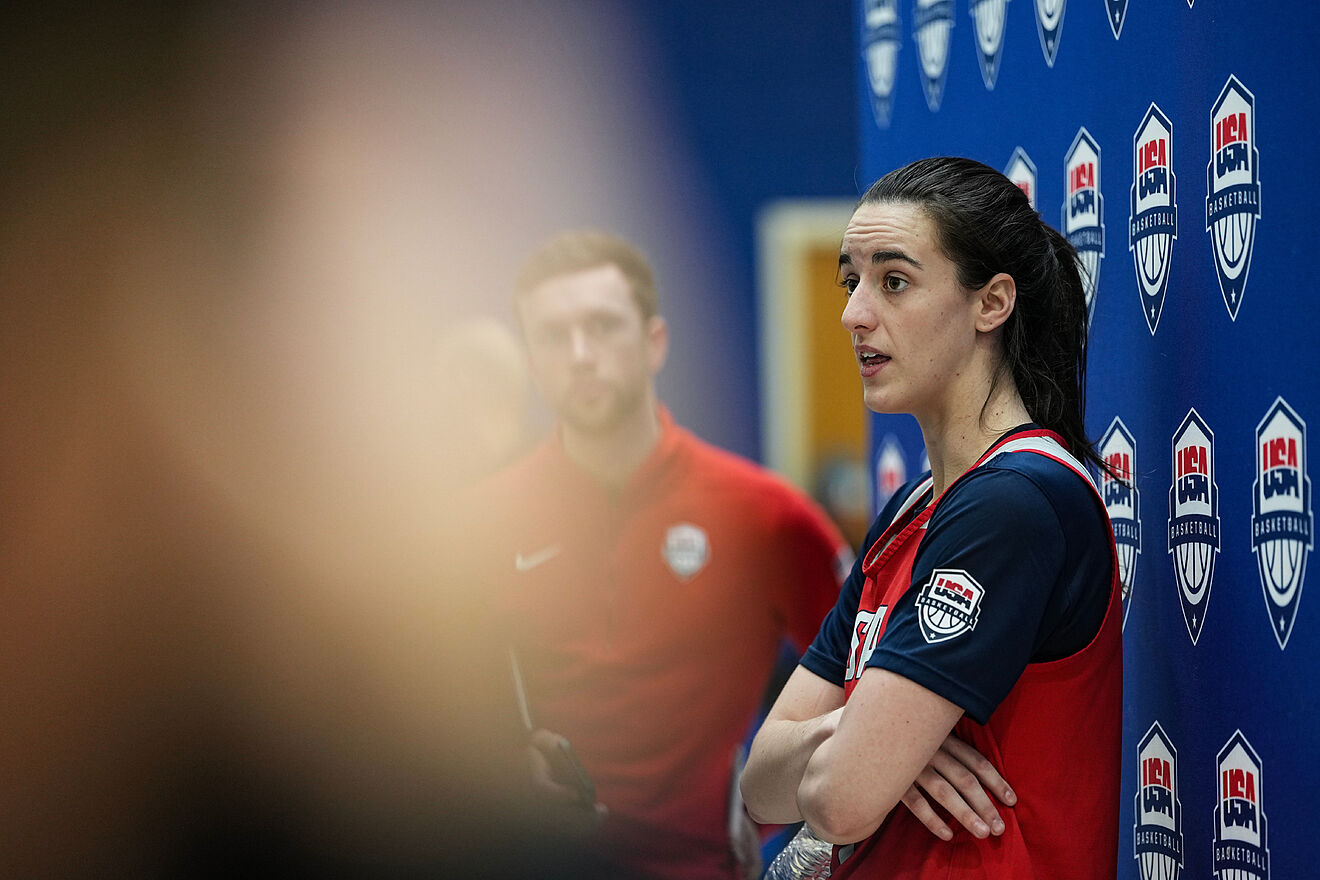 Caitlin Clark speaks to the press.