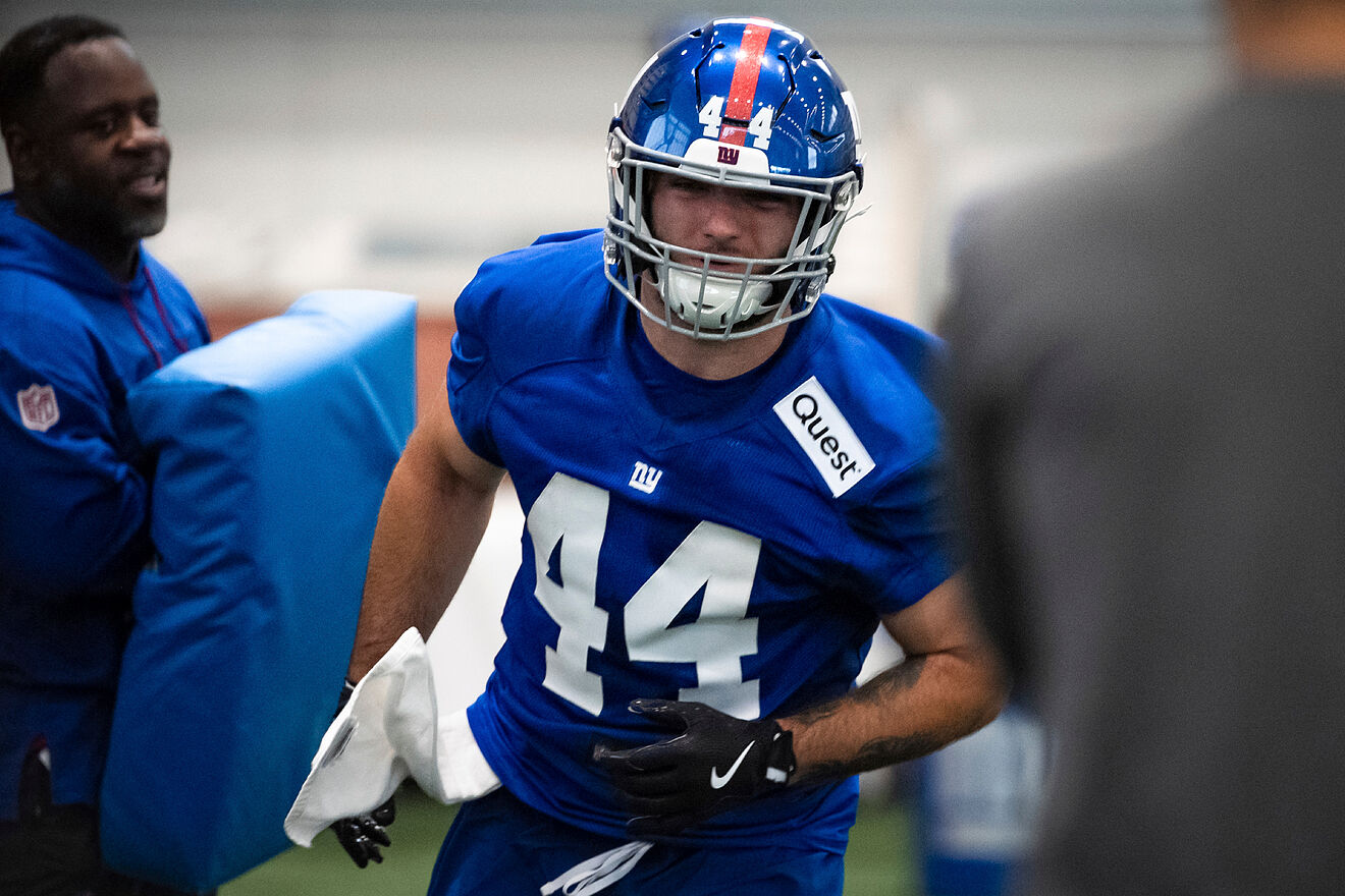 New York Giants running back Cam Skattebo (44) runs drills during the...