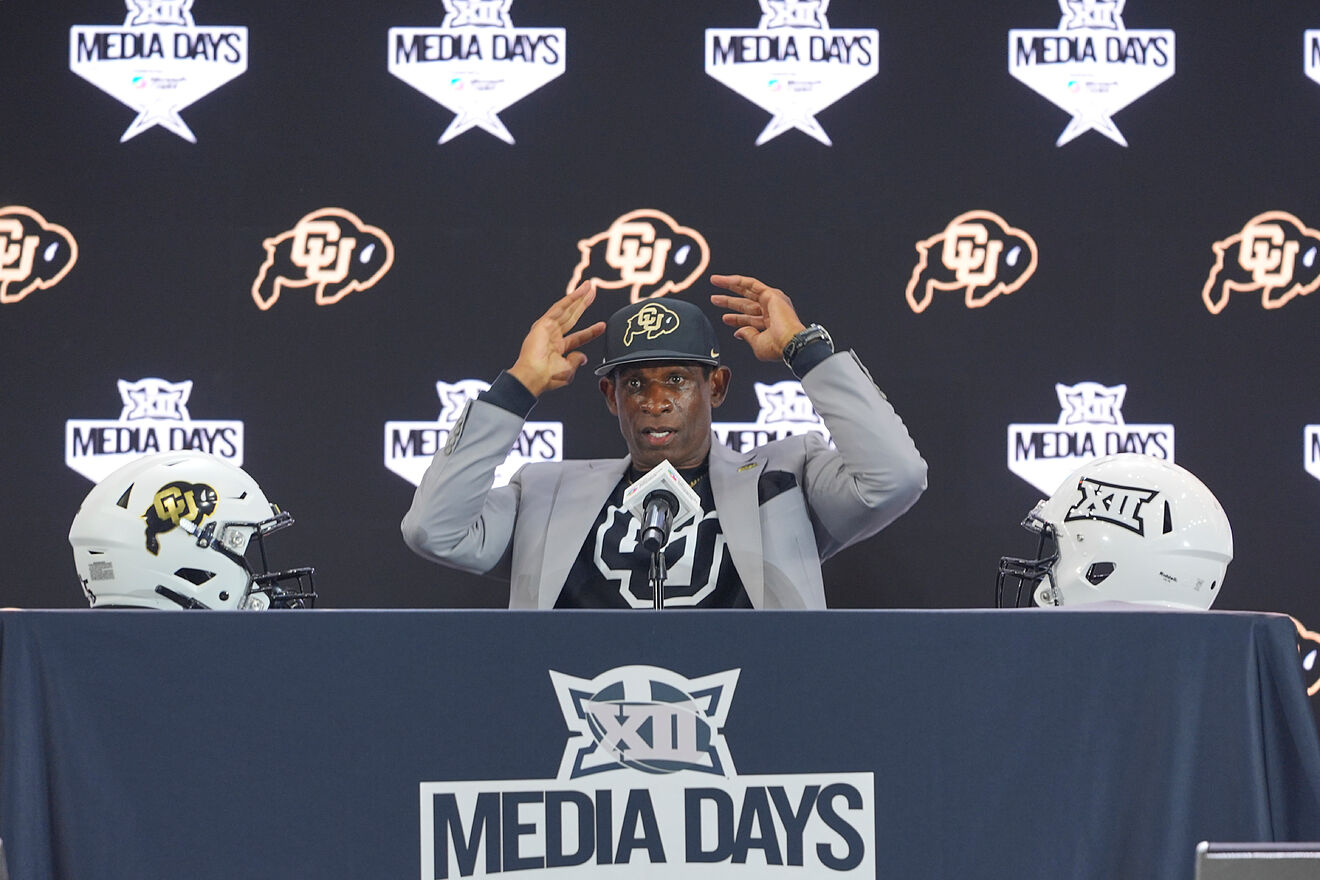 Colorado head coach Deion Sanders gestures after answering questions...