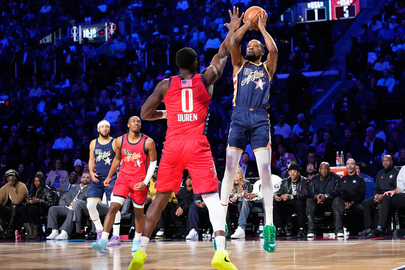 USA Stripes forward Kevin Durant shoots over USA Stars forward Jalen...