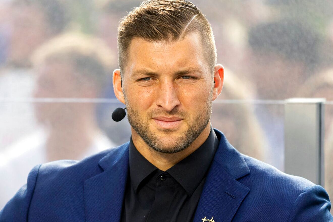 SEC Nation host Tim Tebow listens to his co-hosts during the SEC...