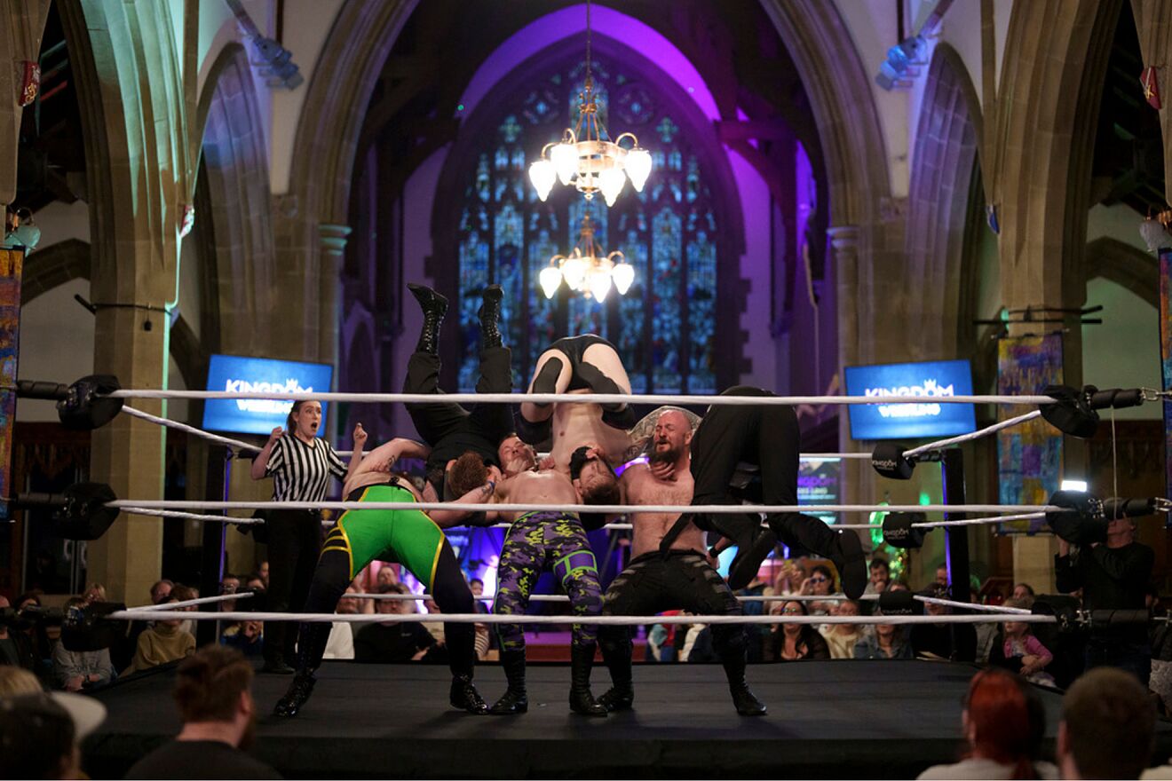 A six-man-scramble plays out in the ring at a Kingdom Wrestling show