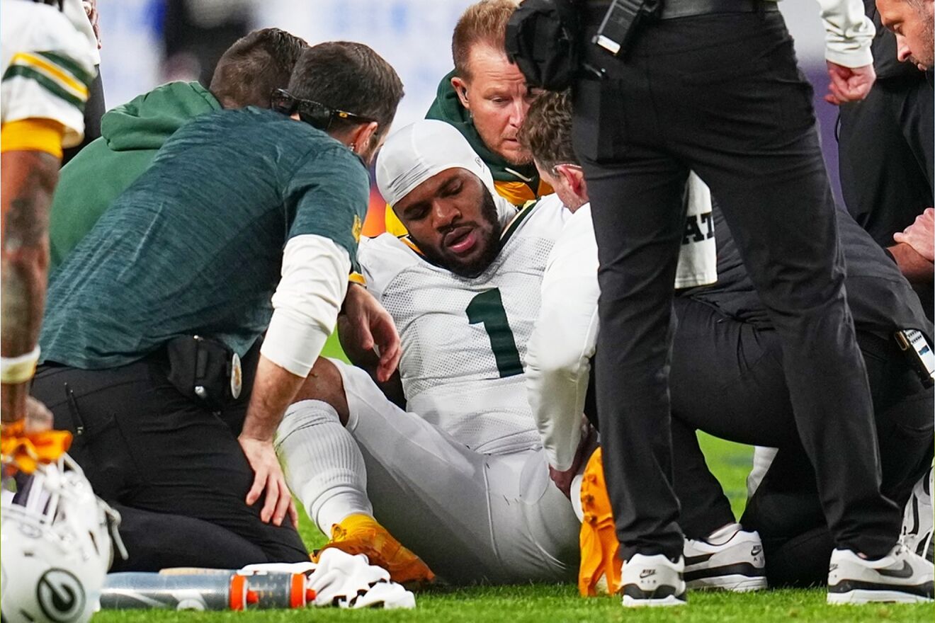 Green Bay Packers' Micah Parsons reacts after an injury during an NFL...