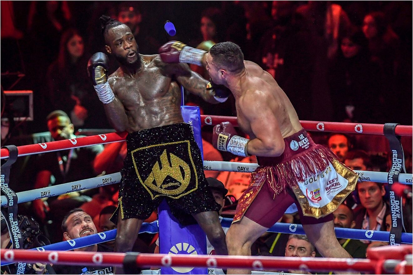 oseph Parker throws a punch at Deontay Wilder.
