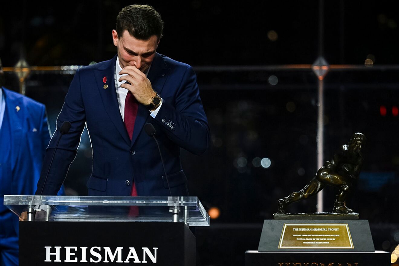 Indiana NCAA college football quarterback Fernando Mendoza reacts...