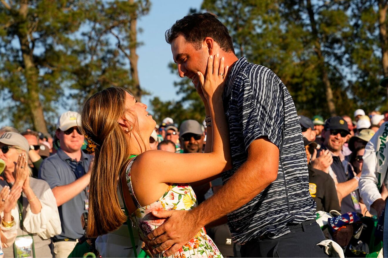 Scottie Scheffler hugs his wife Meredith Scudder after winning the...