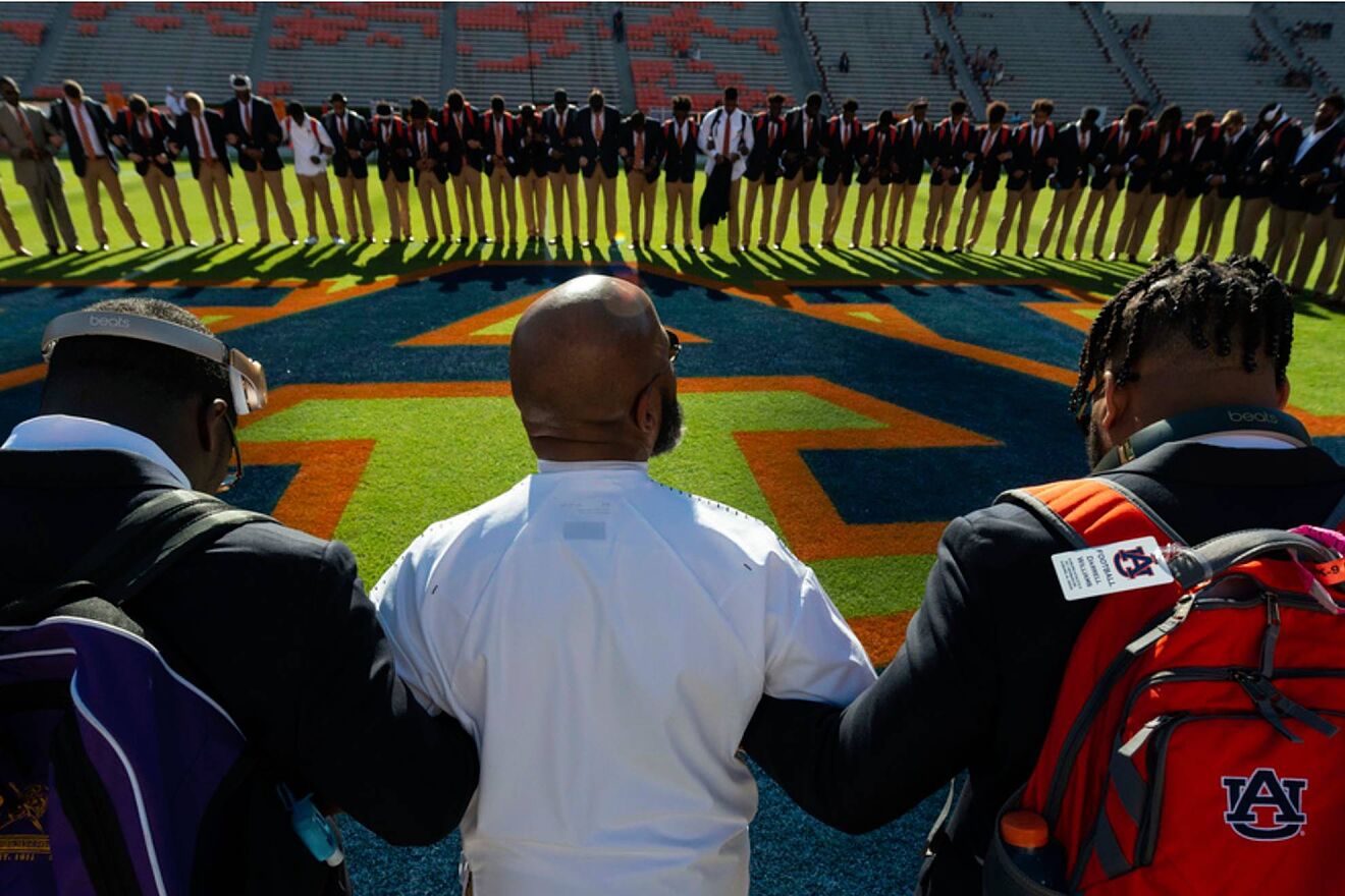 Auburn's chaplain Chette Williams leads the Tigers in prayer before an...