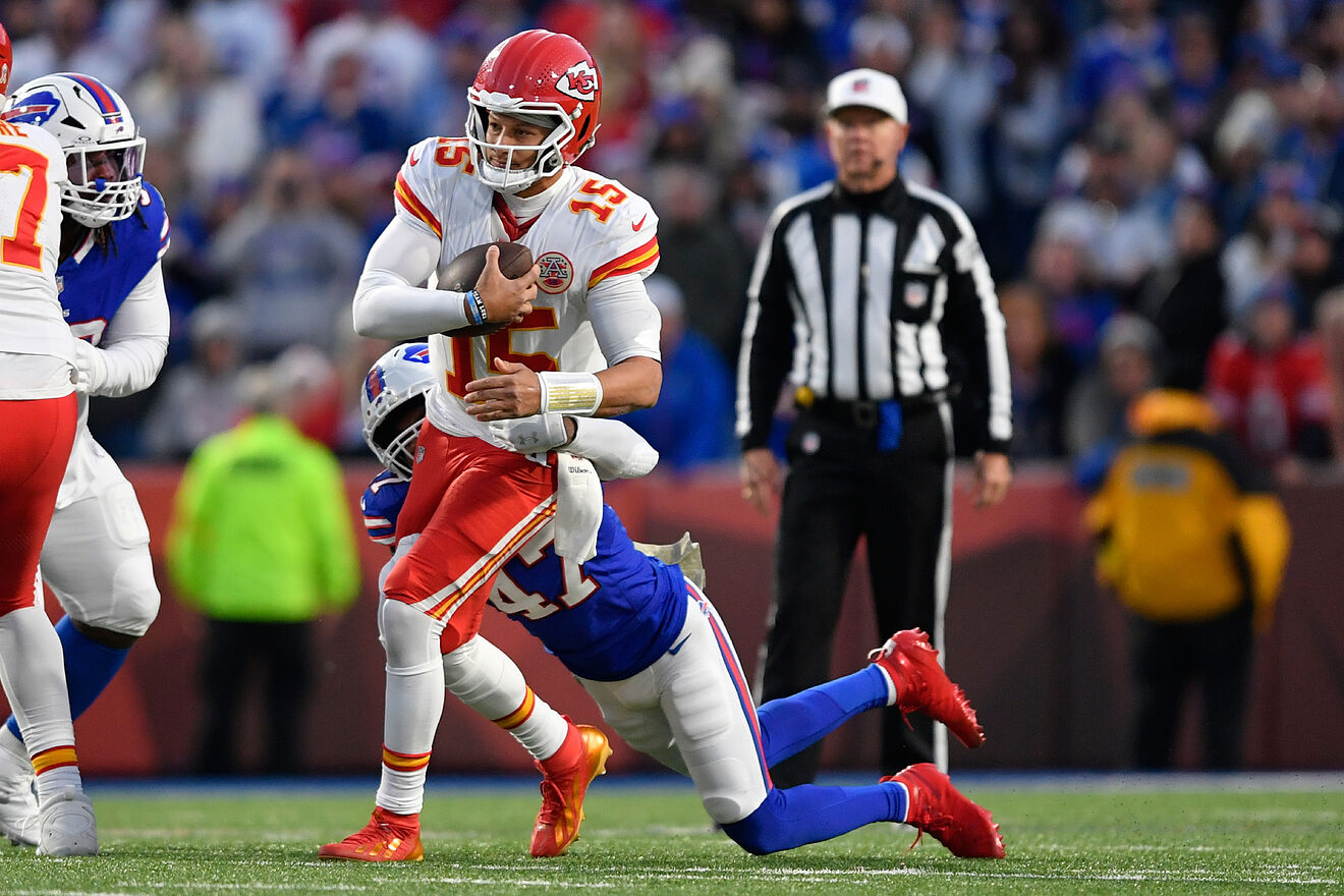 Patrick Mahomes (15) is sacked by Buffalo Bills cornerback Christian...