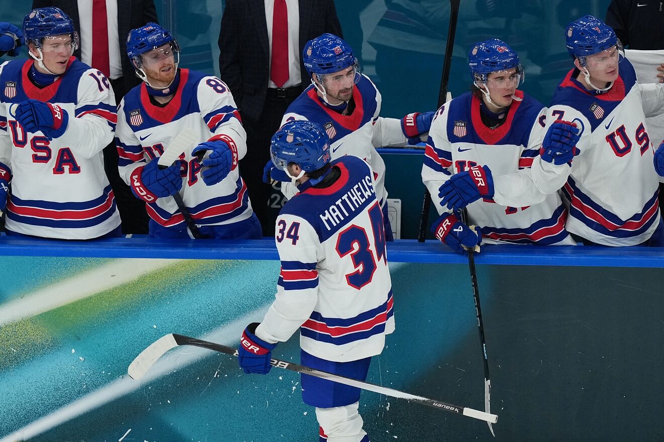 American hockey fans react after officials wipe out two Team USA goals...