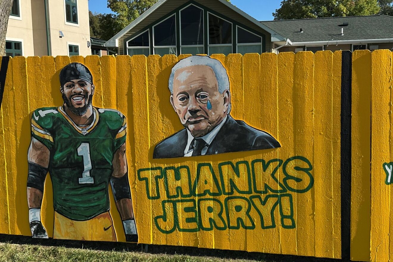 A sign outside a home across the street from Lambeau Field thanks...