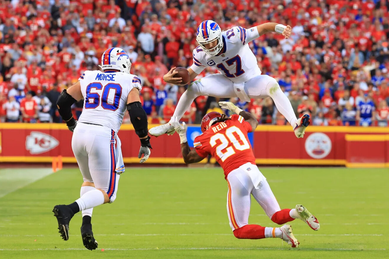Josh Allen jumps over a Chiefs player during their regular season...