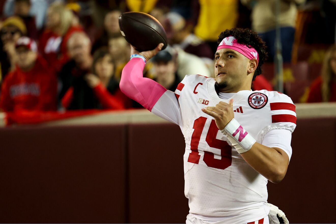 Nebraska quarterback Dylan Raiola warms up before the second half of...
