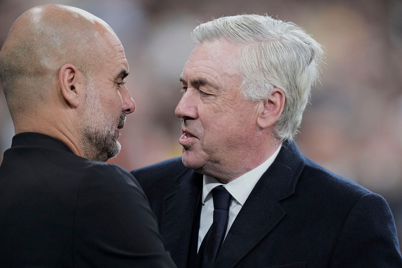 Real Madrid's head coach Carlo Ancelotti, right, speaks with...