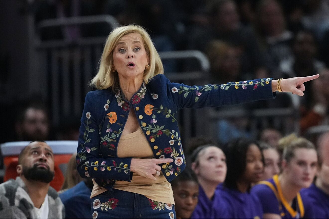 LSU head coach Kim Mulkey signals to her players