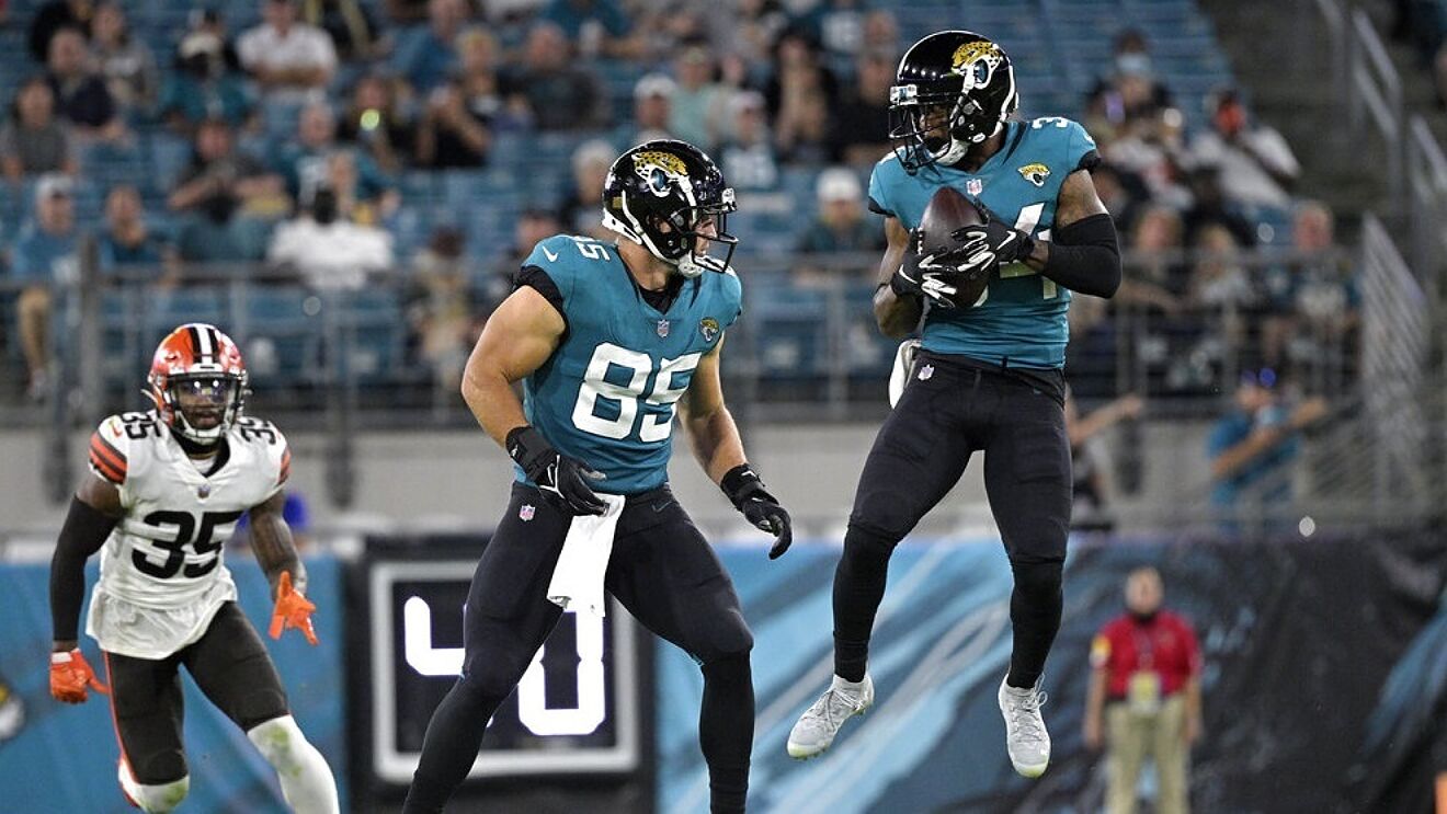 Tavon Austin makes a reception as tight end Tim Tebow looks to block...