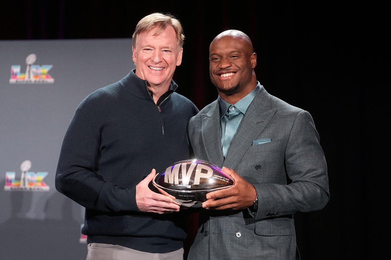 Seattle Seahawks running back Kenneth Walker III, right, holds the...