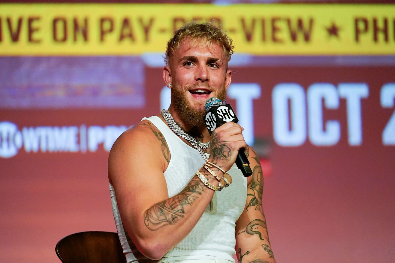 Jake Paul speaks during a news conference.