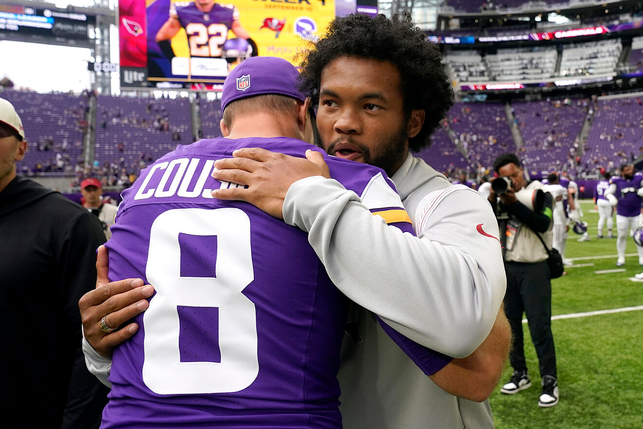 Arizona Cardinals quarterback Kyler Murray is embraced by Minnesota...